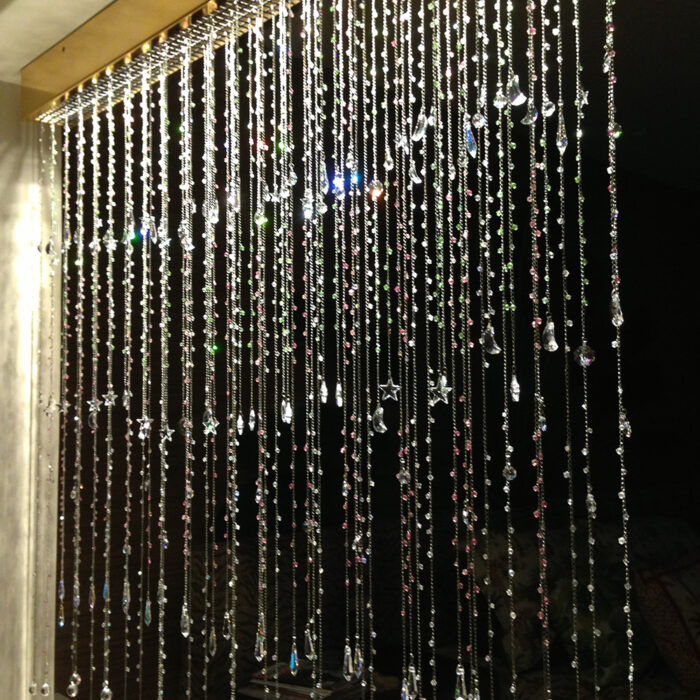 an image of a beautiful lighted curtain made of dangling crystals