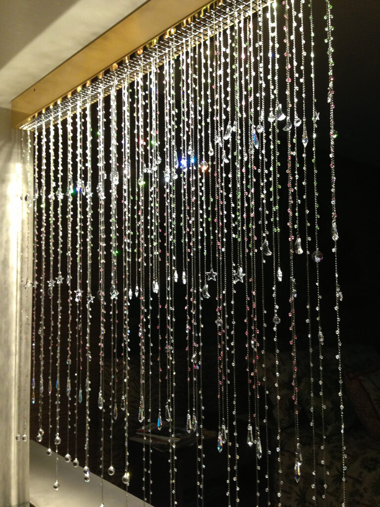 an image of a beautiful lighted curtain made of dangling crystals