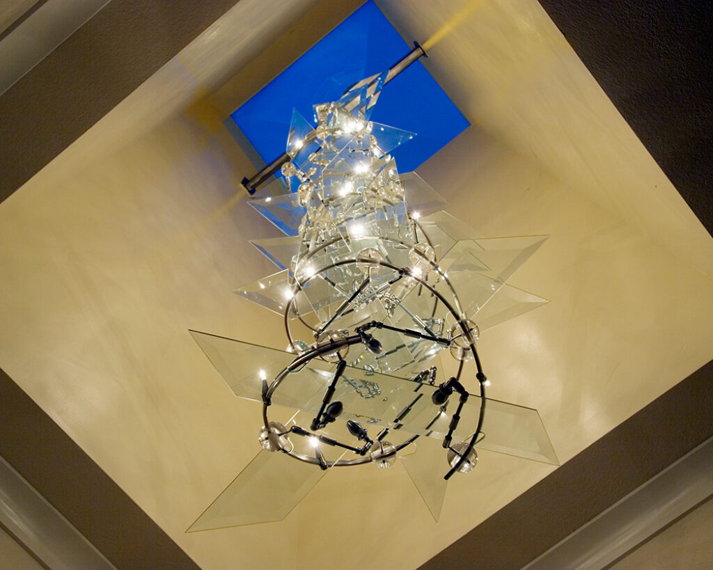 a custom light sculpture resembling a DNA Double Helix strand affixed to the ceiling