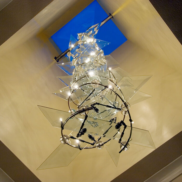 a custom light sculpture resembling a DNA Double Helix strand affixed to the ceiling
