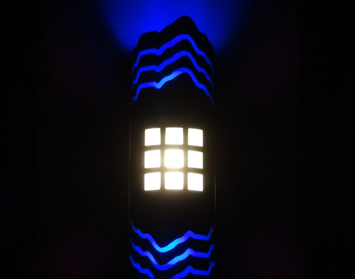 an image of the a blue illuminated wall sconce at Badlands Nightclub