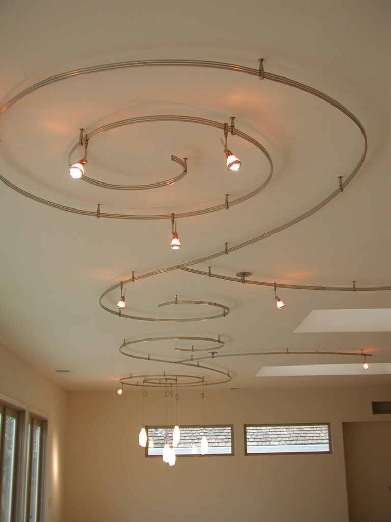 an image of an interior lighting installation of curly lights on a ceiling